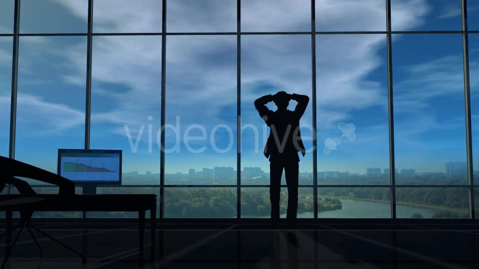A Businessman Holds His Head When Thunder Clouds Gather Around Him - Download Videohive 20524249