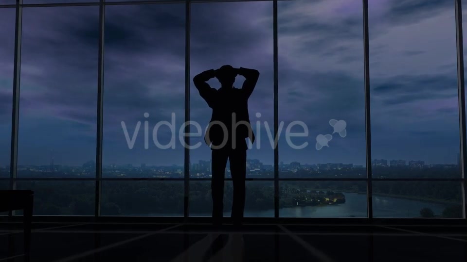 A Businessman Holds His Head When Thunder Clouds Gather Around Him - Download Videohive 20524249