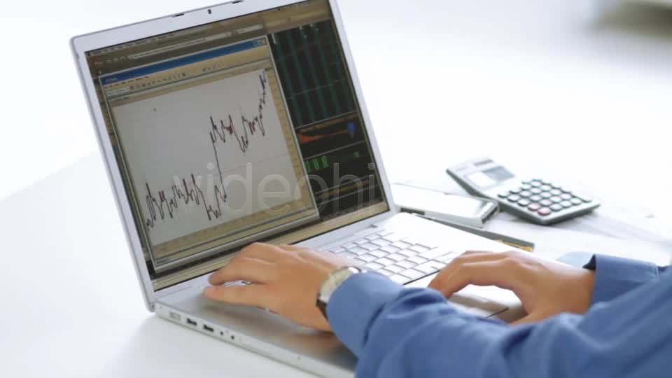 Businessman Checking Stock Market At His Laptop  Videohive 4356192 Stock Footage Image 1