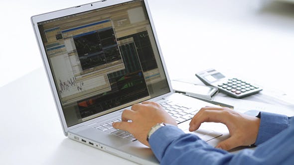 Businessman Checking Stock Market At His Laptop  - 4356192 Download Videohive