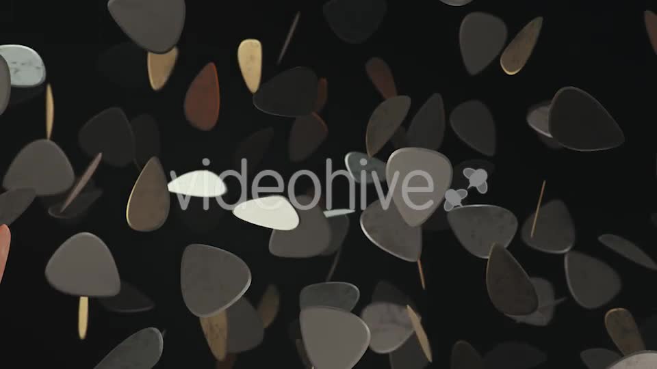 Floating Guitar Plectrums Against a Dark Background - Download Videohive 20290523