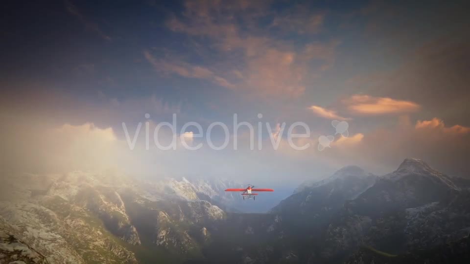 Little Red Airplane Flying Over Mountains - Download Videohive 19162994