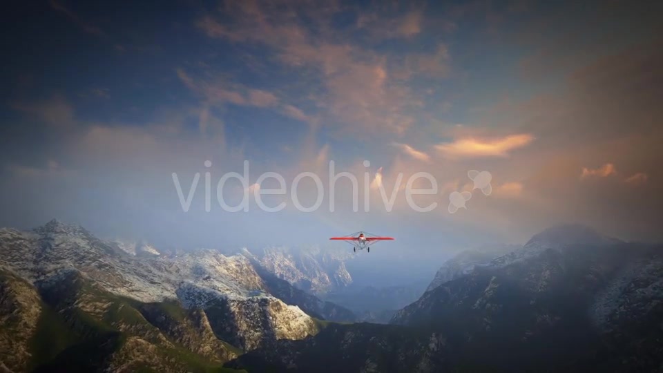 Little Red Airplane Flying Over Mountains - Download Videohive 19162994