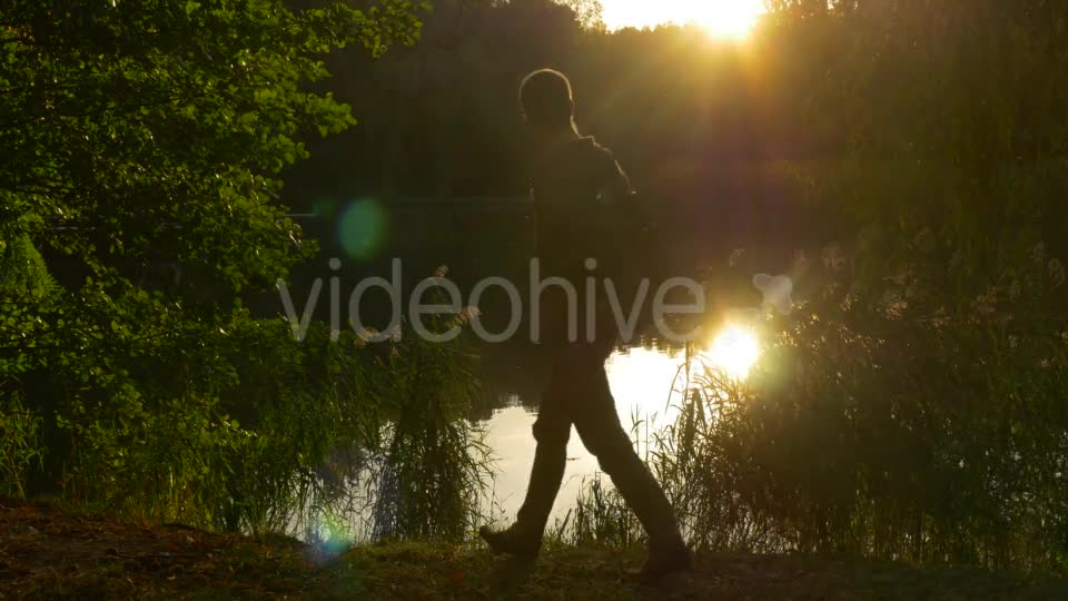 Man Comes To The Lake Sits Down On The Ground - Download Videohive 13488669