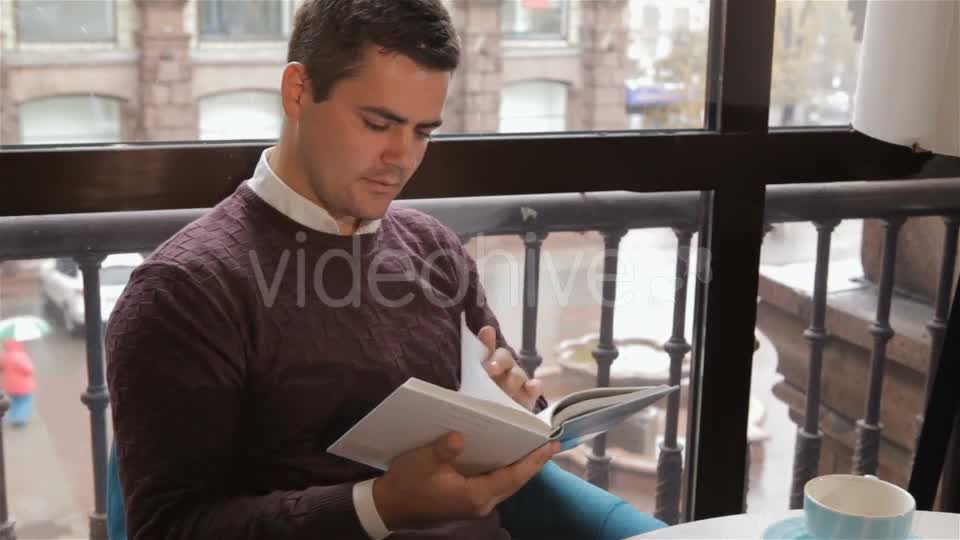 Man Reads Book At The Cafe - Download Videohive 18380237