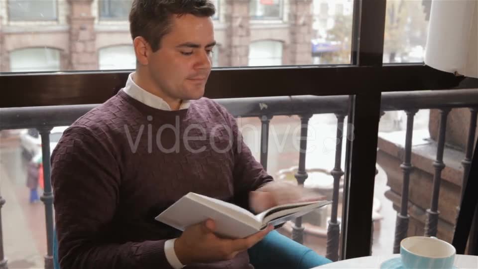 Man Reads Book At The Cafe - Download Videohive 18380237