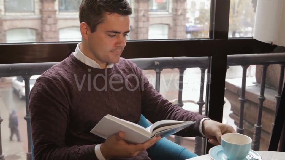 Man Reads Book At The Cafe - Download Videohive 18380237