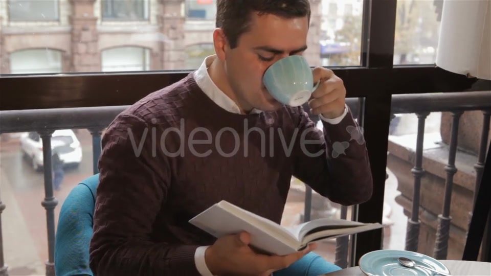 Man Reads Book At The Cafe - Download Videohive 18380237