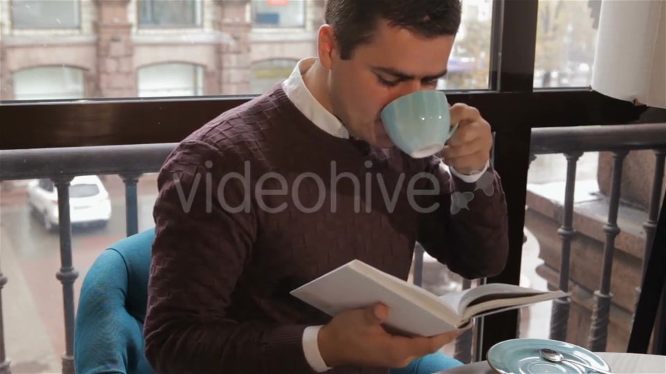 Man Reads Book At The Cafe - Download Videohive 18380237