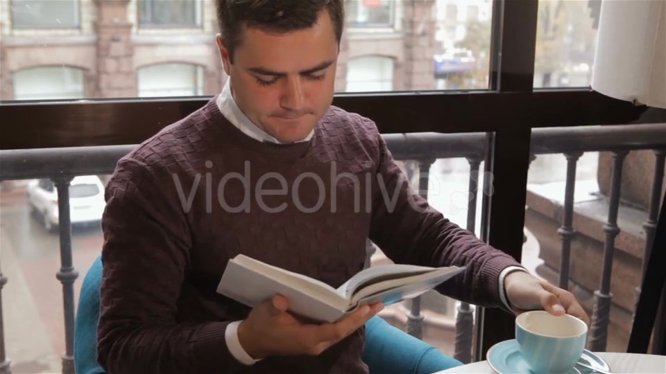 Man Reads Book At The Cafe - Download Videohive 18380237