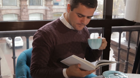 Man Reads Book At The Cafe - Download Videohive 18380237