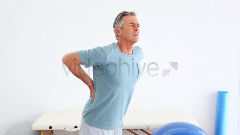Mature Patient Rubbing His Painful Back  Videohive 8490996 Stock Footage Image 2