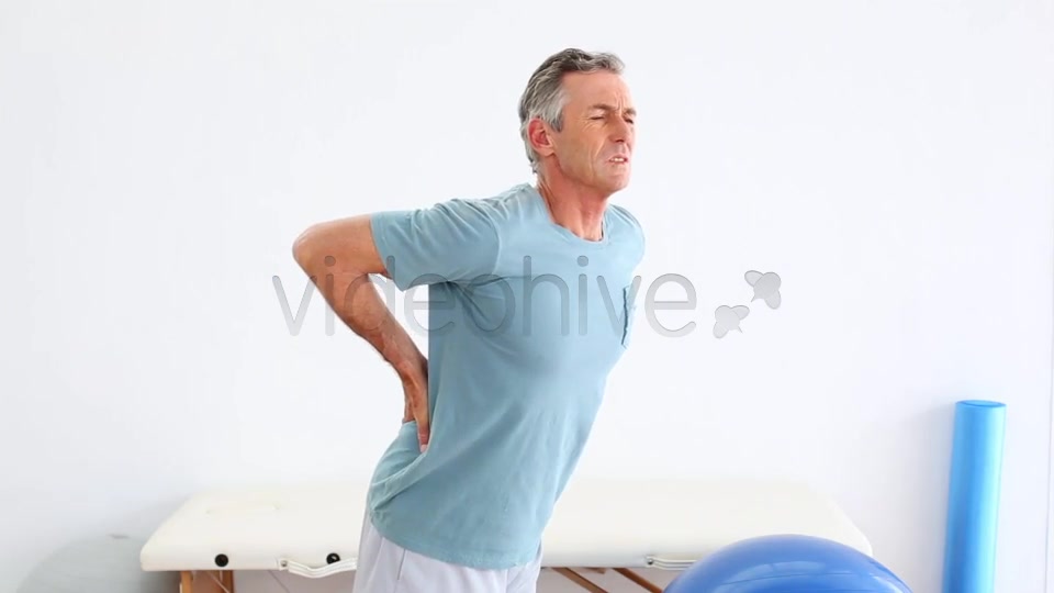 Mature Patient Rubbing His Painful Back  Videohive 8490996 Stock Footage Image 3