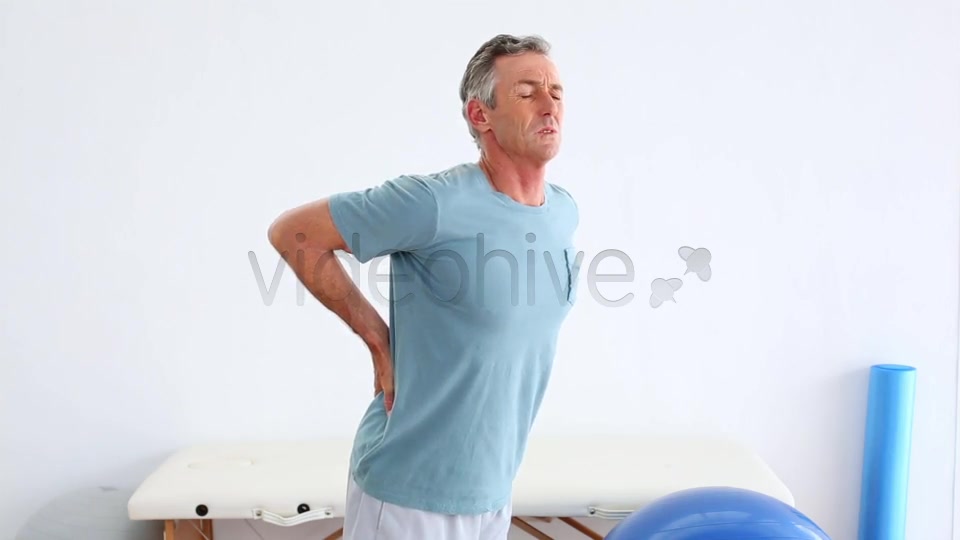 Mature Patient Rubbing His Painful Back  Videohive 8490996 Stock Footage Image 8