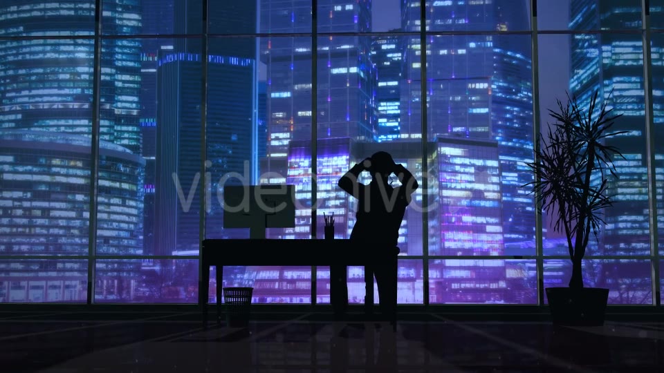 Silhouette Of A Man Working Late In The Office - Download Videohive 20833157