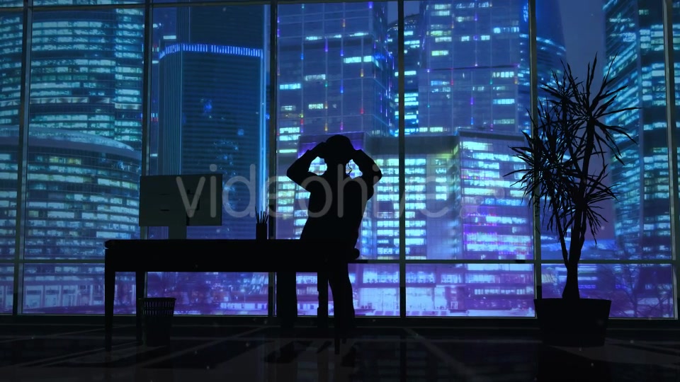 Silhouette Of A Man Working Late In The Office - Download Videohive 20833157