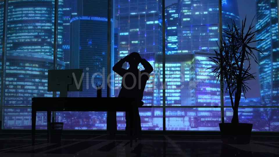 Silhouette Of A Man Working Late In The Office - Download Videohive 20833157