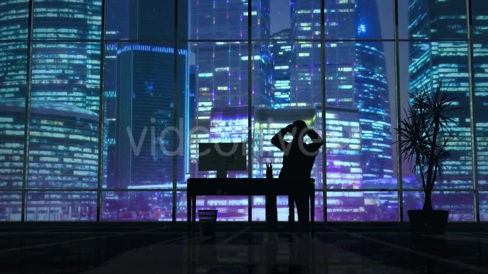 Silhouette Of A Man Working Late In The Office - Download Videohive 20833218