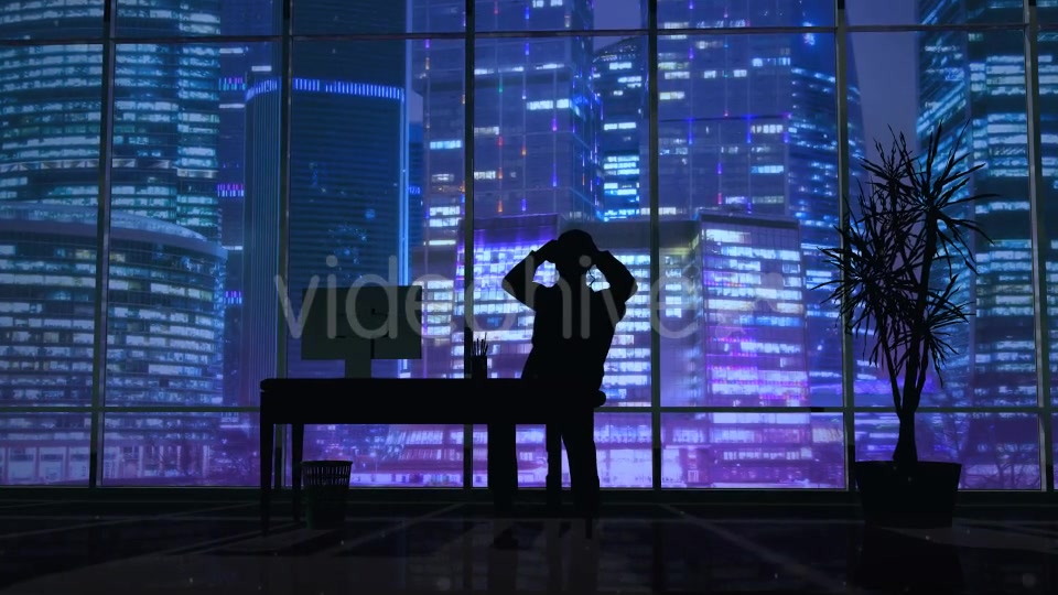 Silhouette Of A Man Working Late In The Office - Download Videohive 20833218