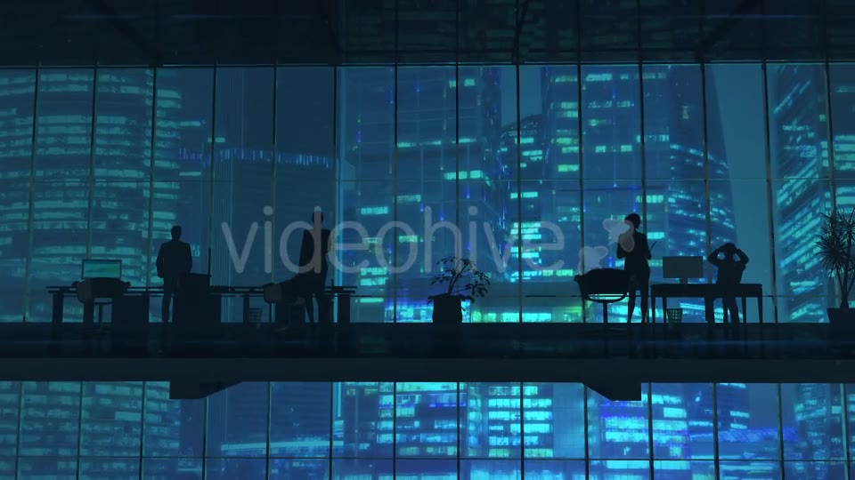 Silhouettes In An Office Building Against Of Skyscrapers - Download Videohive 20524474