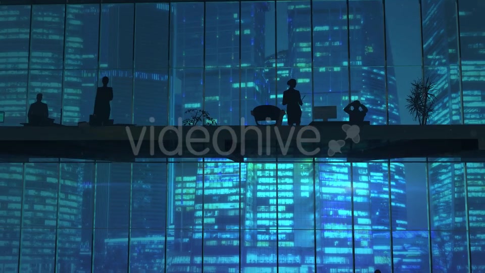 Silhouettes In An Office Building Against Of Skyscrapers - Download Videohive 20524474