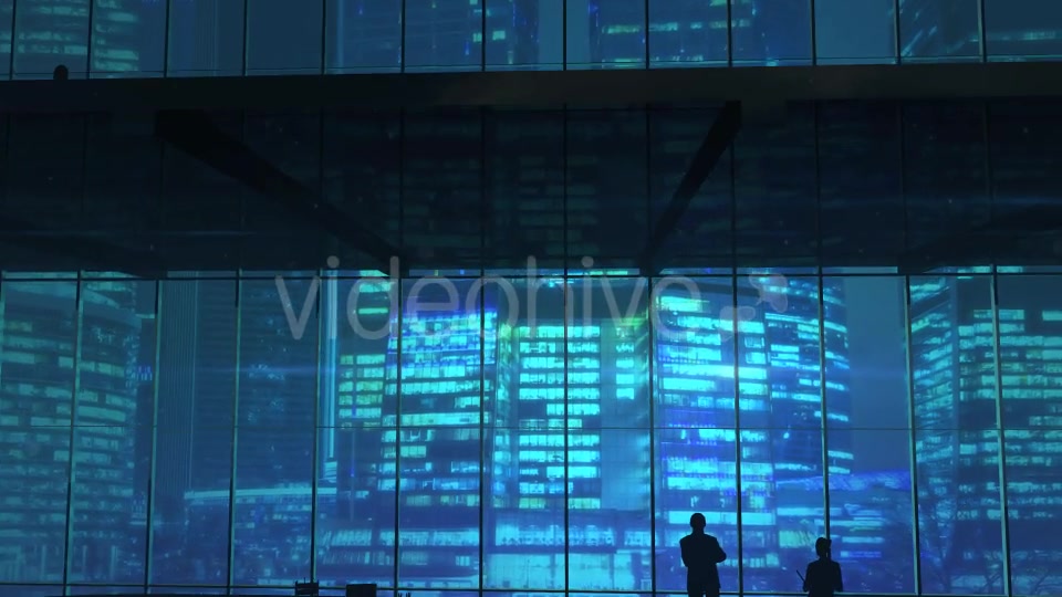 Silhouettes In An Office Building Against Of Skyscrapers - Download Videohive 20524474