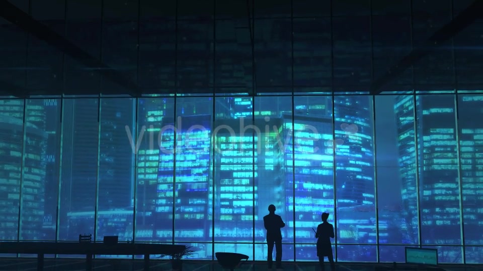 Silhouettes In An Office Building Against Of Skyscrapers - Download Videohive 20524474