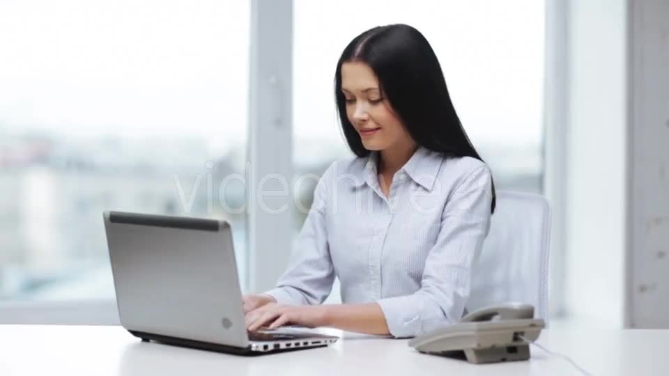 Smiling Businesswoman With Laptop Calling On Phone  - Download Videohive 11465240