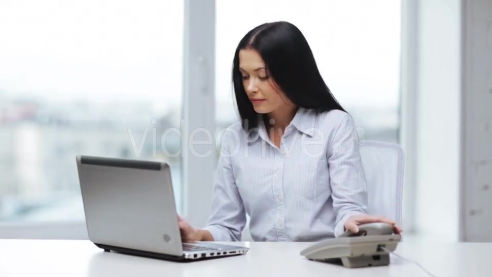 Smiling Businesswoman With Laptop Calling On Phone  - Download Videohive 11465240