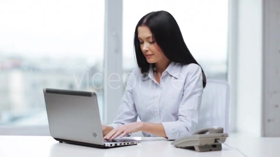 Smiling Businesswoman With Laptop Calling On Phone  - Download Videohive 11465240