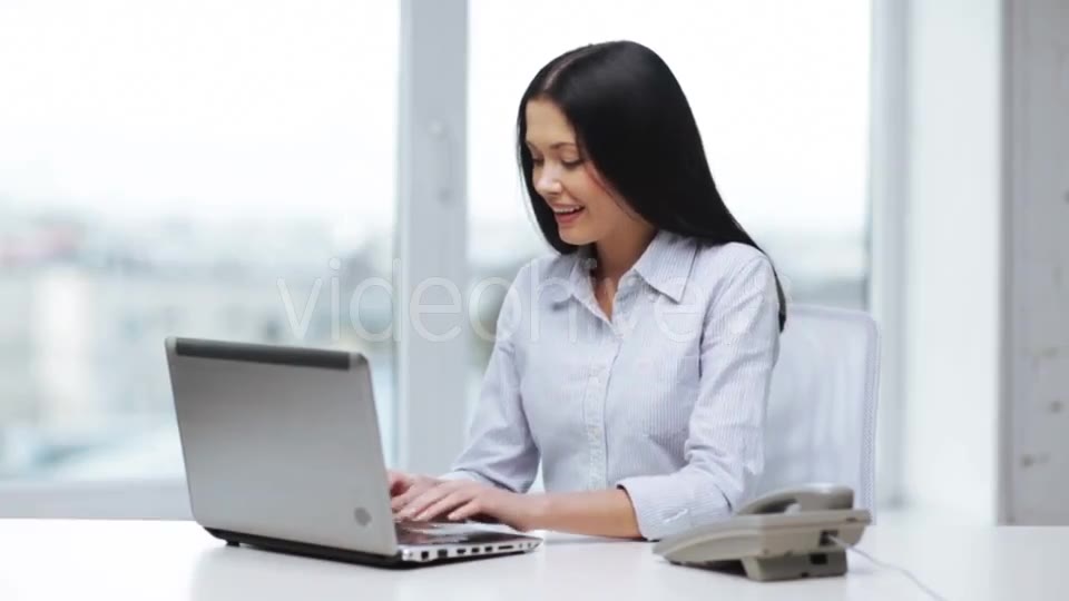 Smiling Businesswoman With Laptop Calling On Phone  - Download Videohive 11465240