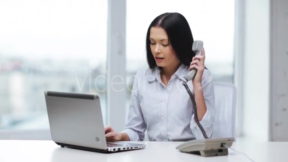 Smiling Businesswoman With Laptop Calling On Phone  - Download Videohive 11465240