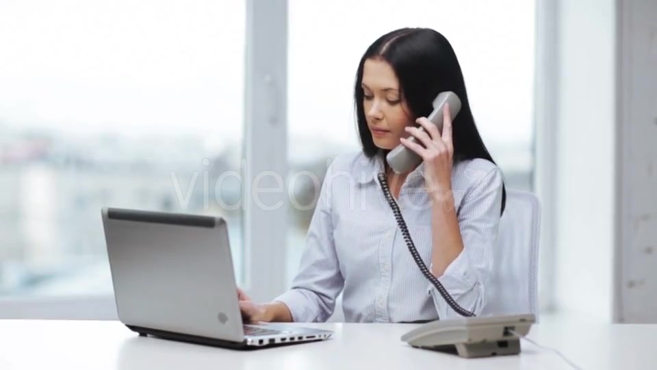 Smiling Businesswoman With Laptop Calling On Phone  - Download Videohive 11465240