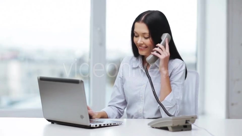 Smiling Businesswoman With Laptop Calling On Phone  - Download Videohive 11465240