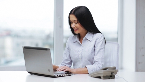 Smiling Businesswoman With Laptop Calling On Phone  - Download Videohive 11465240