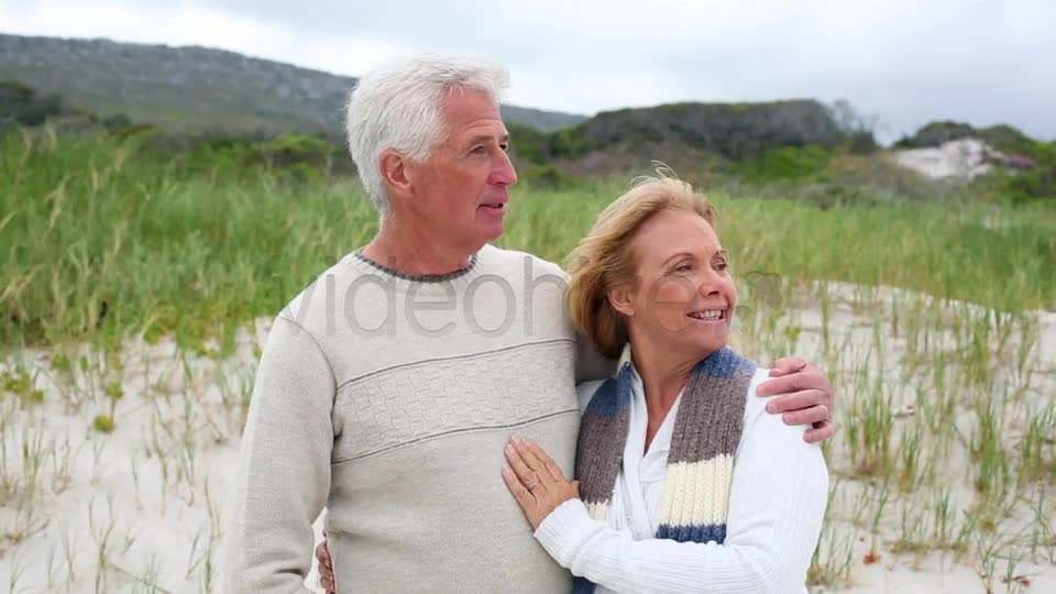 Smiling Retired Couple Standing On The Beach  Videohive 8435982 Stock Footage Image 1