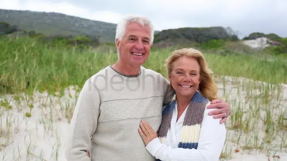 Smiling Retired Couple Standing On The Beach  Videohive 8435982 Stock Footage Image 11