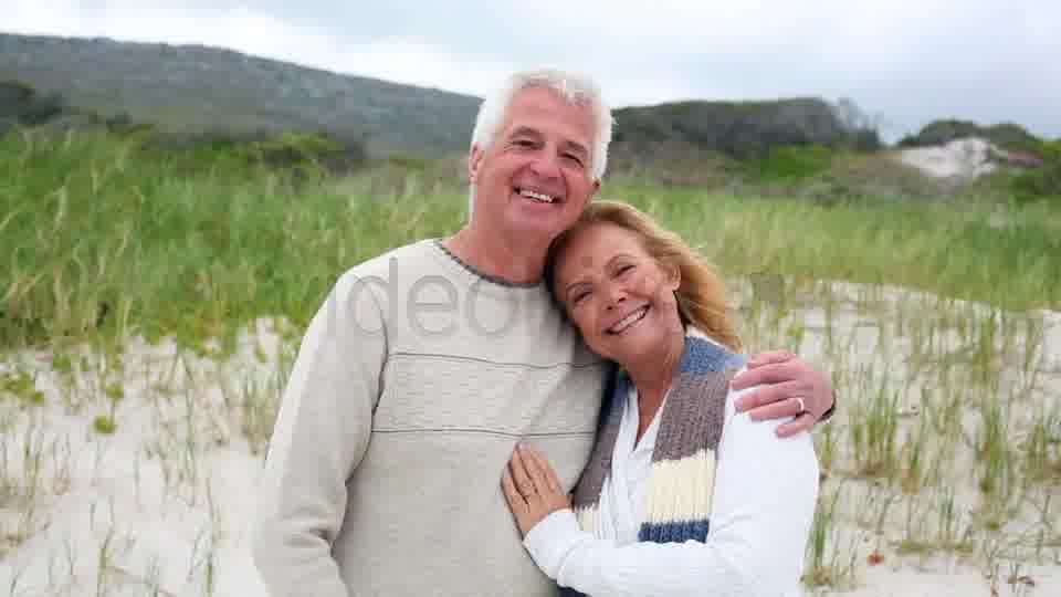 Smiling Retired Couple Standing On The Beach  Videohive 8435982 Stock Footage Image 12