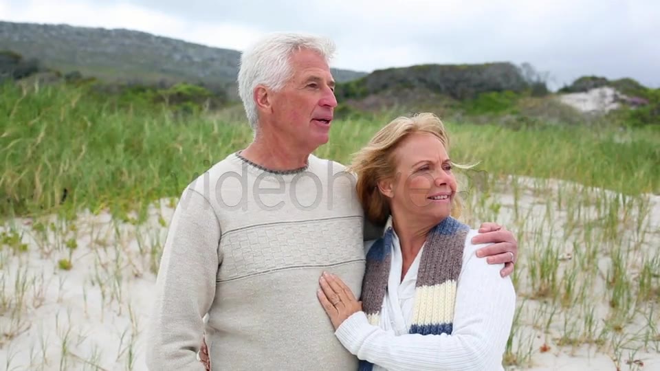 Smiling Retired Couple Standing On The Beach  Videohive 8435982 Stock Footage Image 2