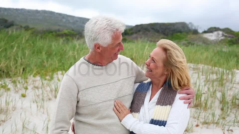 Smiling Retired Couple Standing On The Beach  Videohive 8435982 Stock Footage Image 8