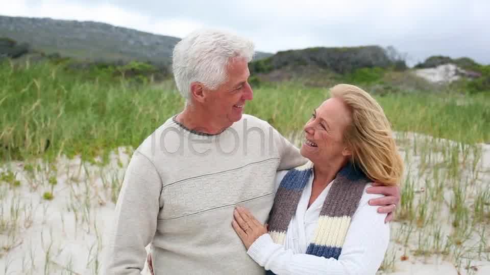Smiling Retired Couple Standing On The Beach  Videohive 8435982 Stock Footage Image 9