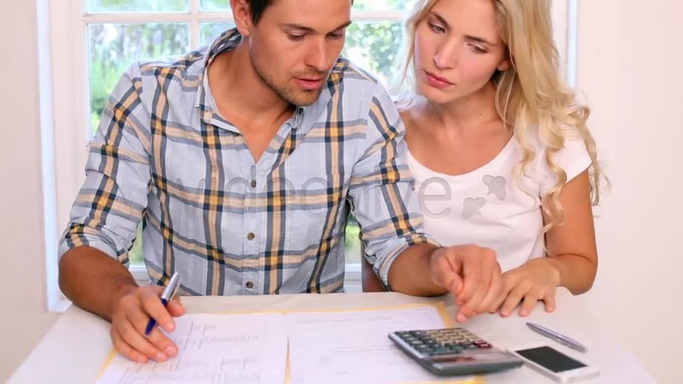 Stressed Young Paying Their Bills Together  Videohive 8505792 Stock Footage Image 1