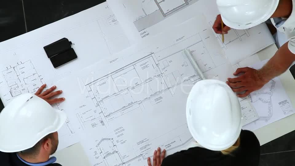 Young Architects Working On New Construction With Blueprints  Videohive 8841017 Stock Footage Image 1