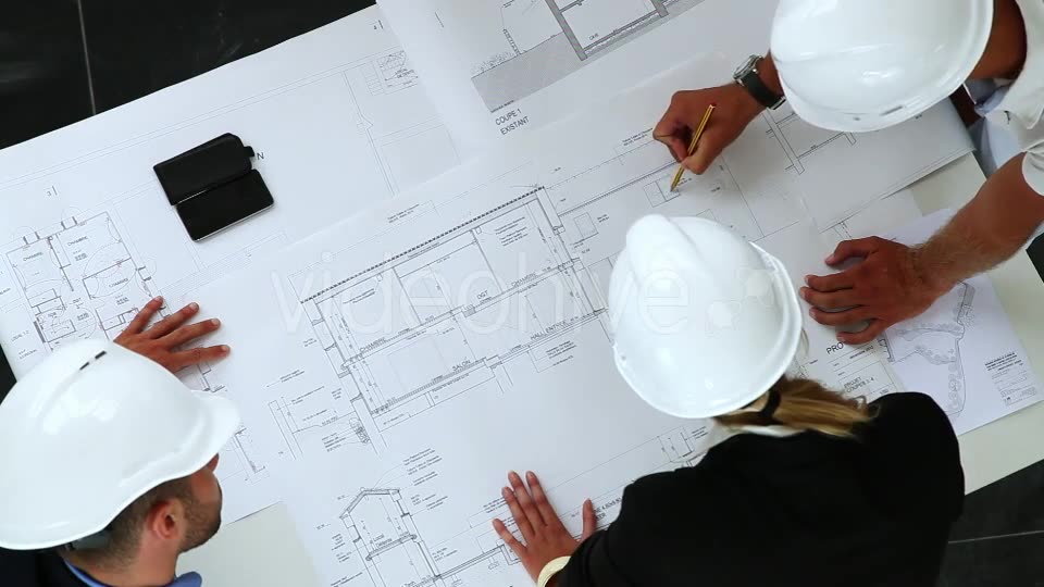Young Architects Working On New Construction With Blueprints  Videohive 8841017 Stock Footage Image 2