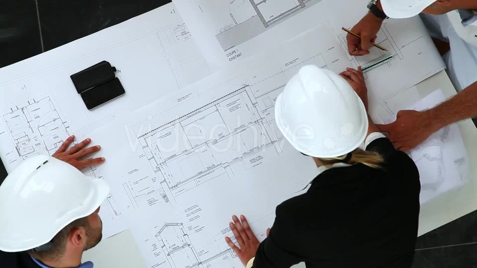 Young Architects Working On New Construction With Blueprints  Videohive 8841017 Stock Footage Image 3