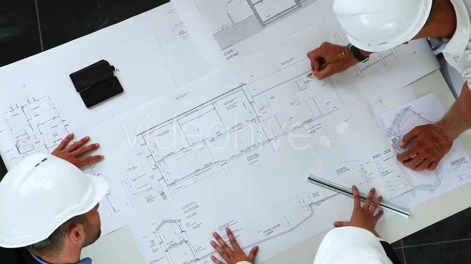 Young Architects Working On New Construction With Blueprints  Videohive 8841017 Stock Footage Image 4