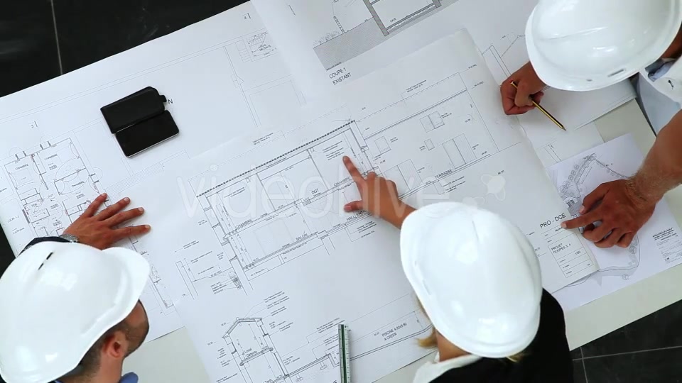 Young Architects Working On New Construction With Blueprints  Videohive 8841017 Stock Footage Image 8