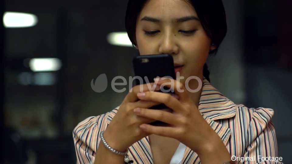 Asian Teenage Girl Using a Mobile Phone to Buy Online Products Videohive 21879990 Motion Graphics Image 7