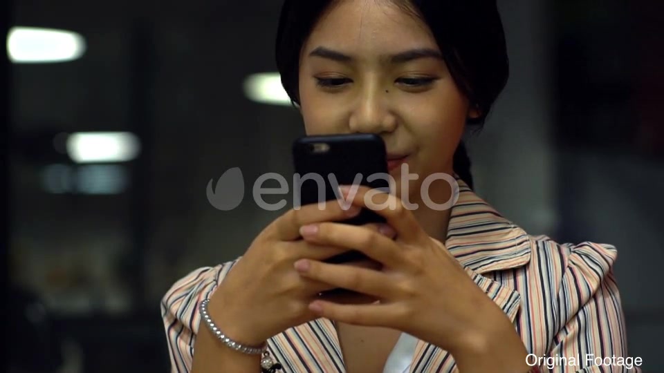 Asian Teenage Girl Using a Mobile Phone to Buy Online Products Videohive 21879990 Motion Graphics Image 8