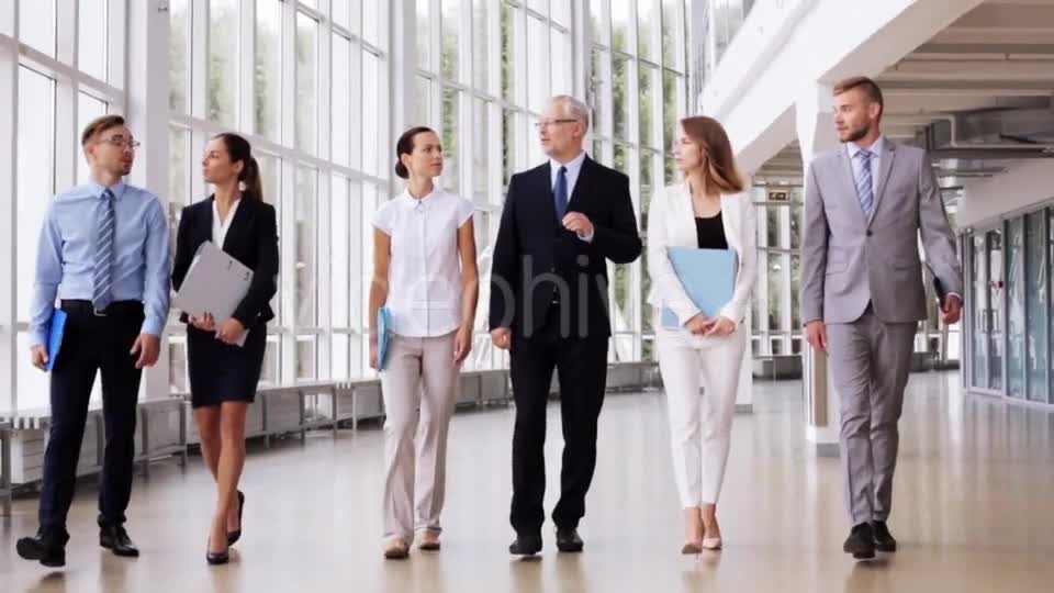 Business People Walking Along Office Building 7  Videohive 17383517 Stock Footage Image 1